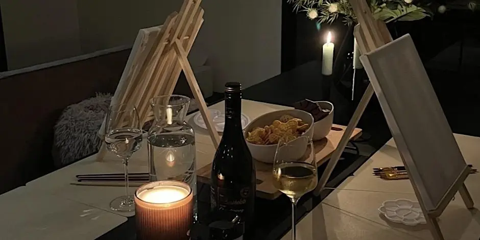 Romantic dinner with painting setup.