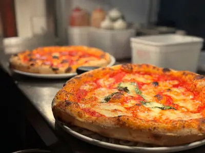 Menus at alfredo's, an image of 2 freshly baked pizzas